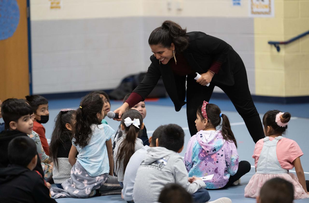 Children watch a host and pianist at a Cliburn in the Classroom program